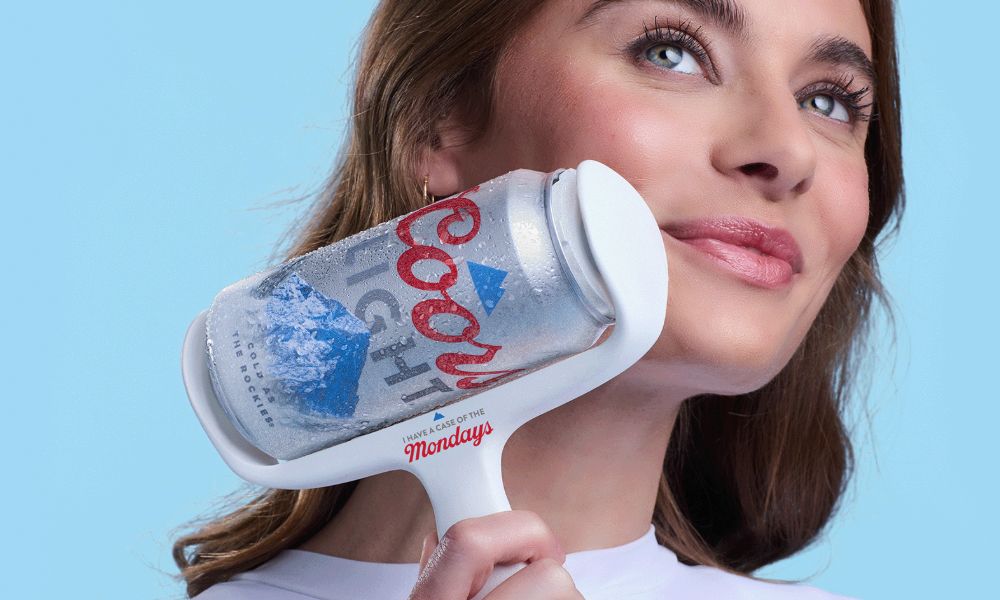 woman using a coors light can as an ice roller