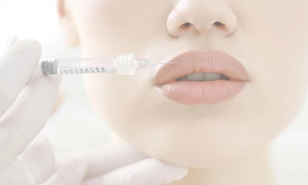 zoomed in image of woman getting lip fillers
