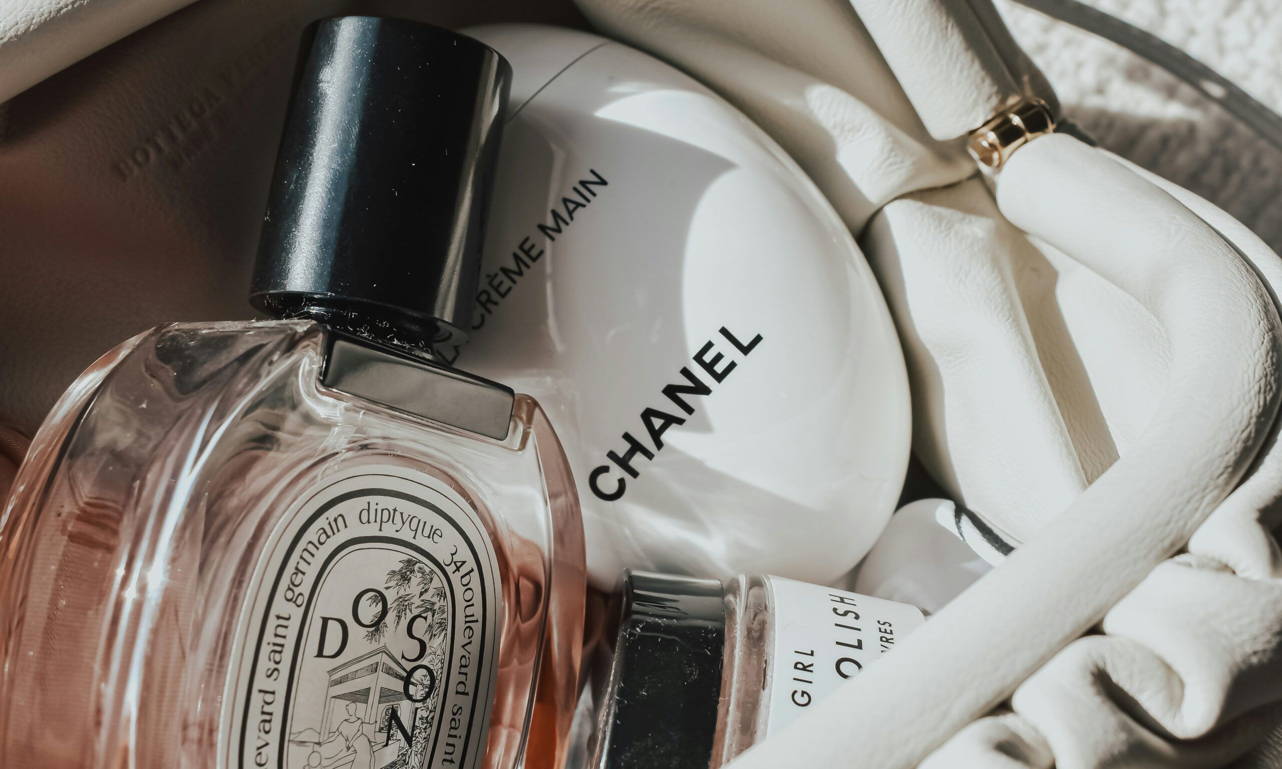 chanel and dipityque beauty products in a bag