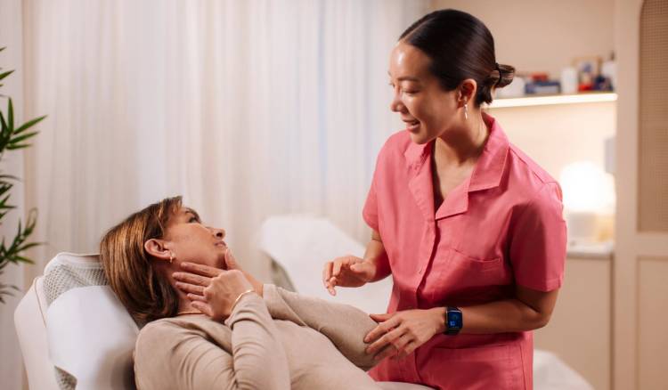 Woman in her 40s or 50s during a facial plastic surgery consultation