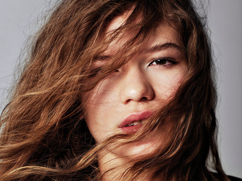 woman with brownish hair in face