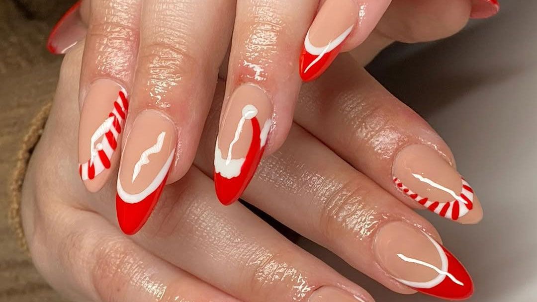 Red French manicure with candy cane designs