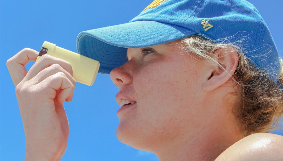 woman using stick sunscreen