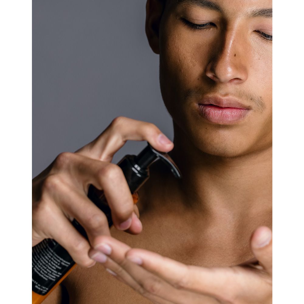 Model using Black Mona Lisa Beauty Kale Cleanser