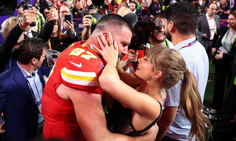 LAS VEGAS, NEVADA - FEBRUARY 11: Travis Kelce #87 of the Kansas City Chiefs celebrates with Taylor Swift after defeating the San Francisco 49ers 25-22 in overtime during Super Bowl LVIII at Allegiant Stadium on February 11, 2024 in Las Vegas, Nevada.