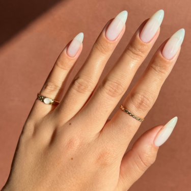image of hand with long porcelain-inspired nail polish
