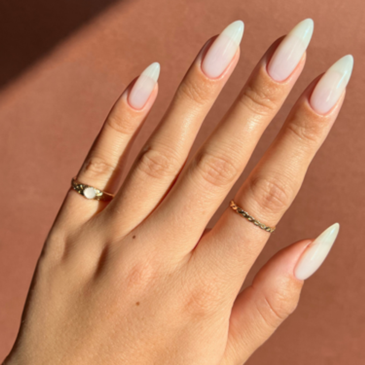 image of hand with long porcelain-inspired nail polish