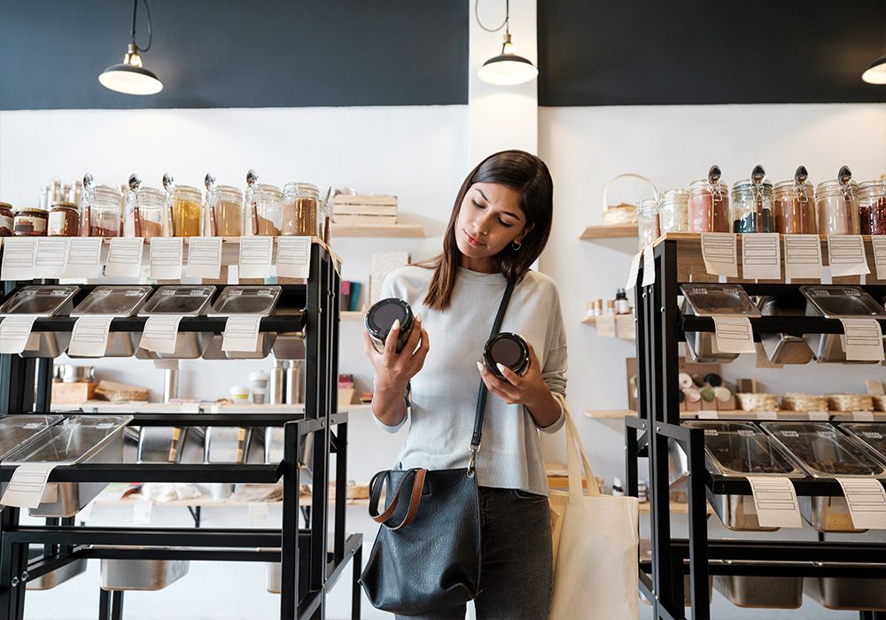 woman reading cosmetic labels