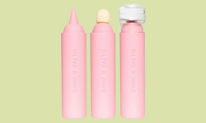 olive & june penny nail art tool on green background