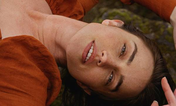 face portrait of woman laying on the ground