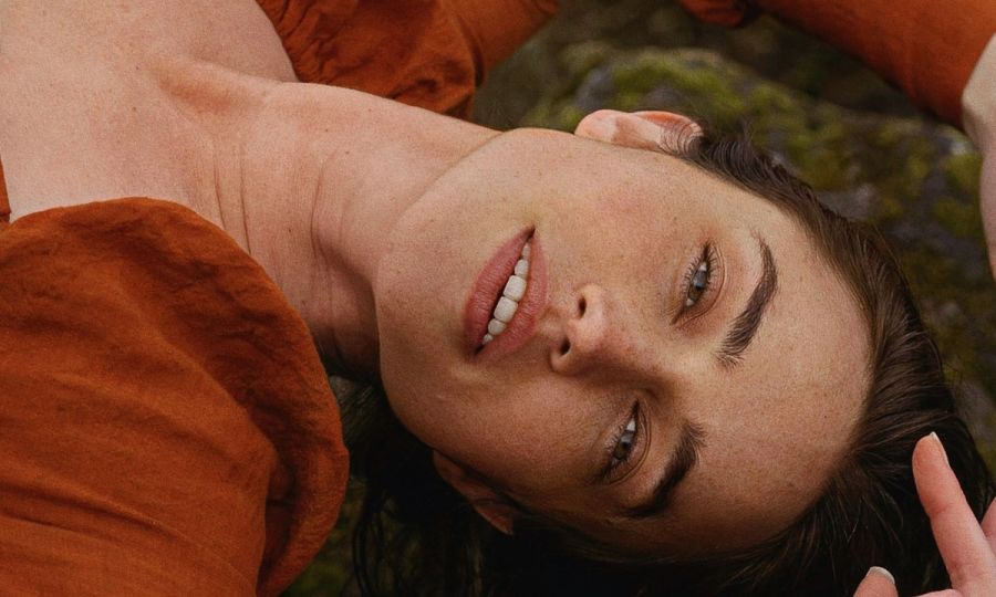 face portrait of woman laying on the ground