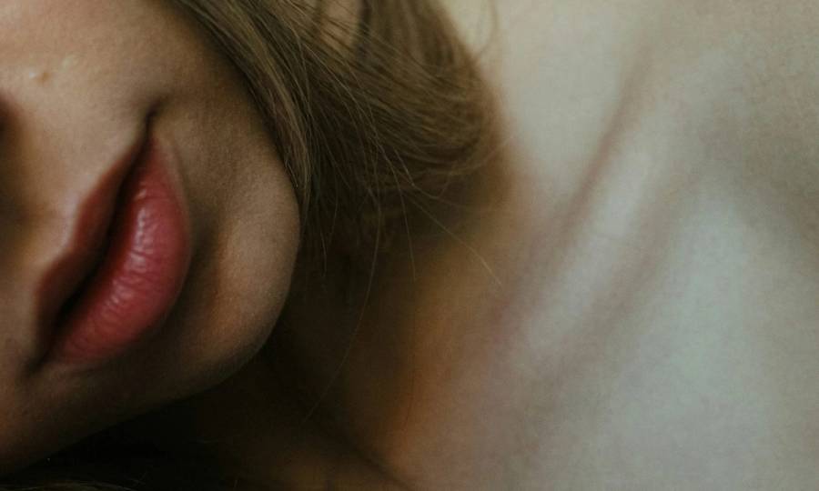 zoomed in image of woman's neck and chin area