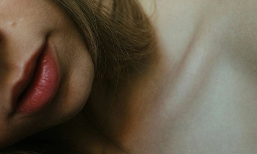 zoomed in image of woman's neck and chin area