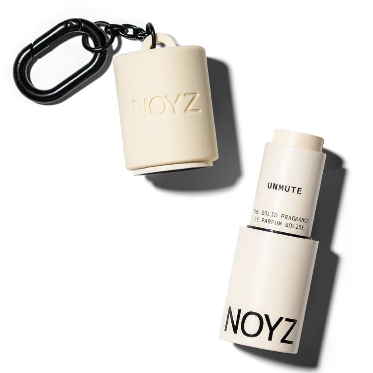 NOYZ solid fragrance bag charm keychain, a compact portable scent accessory designed for on-the-go fragrance reapplication