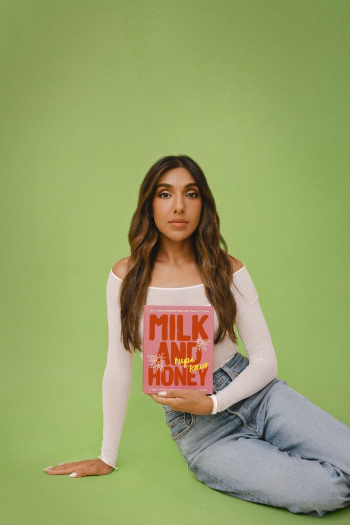 Rupi Kaur with her book, Milk and Honey