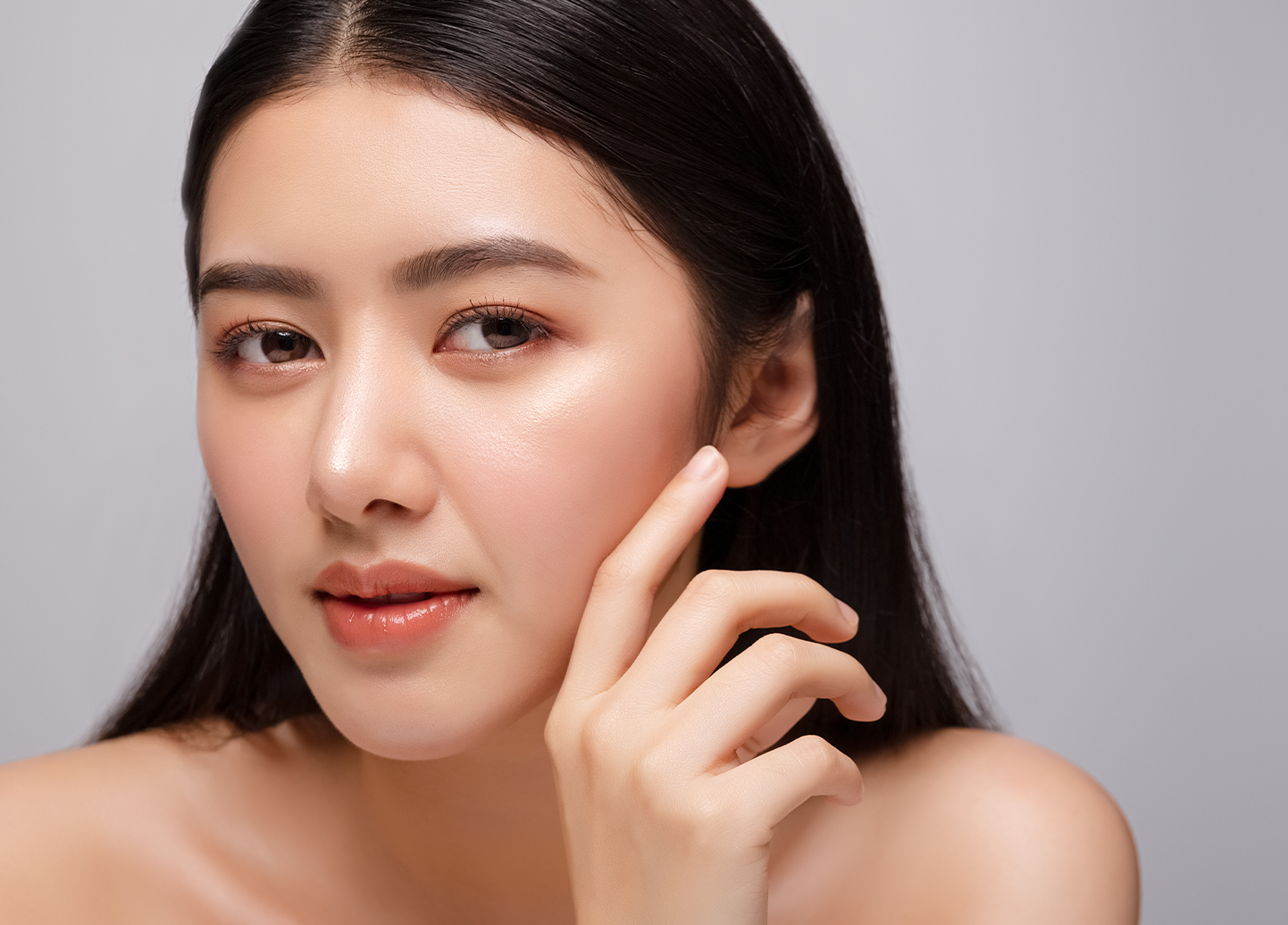 woman touching cheek