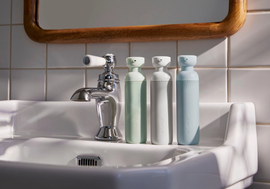 SURI's Restore Gel Refillable Toothpaste bottles in Meadow, Stone and Sky.