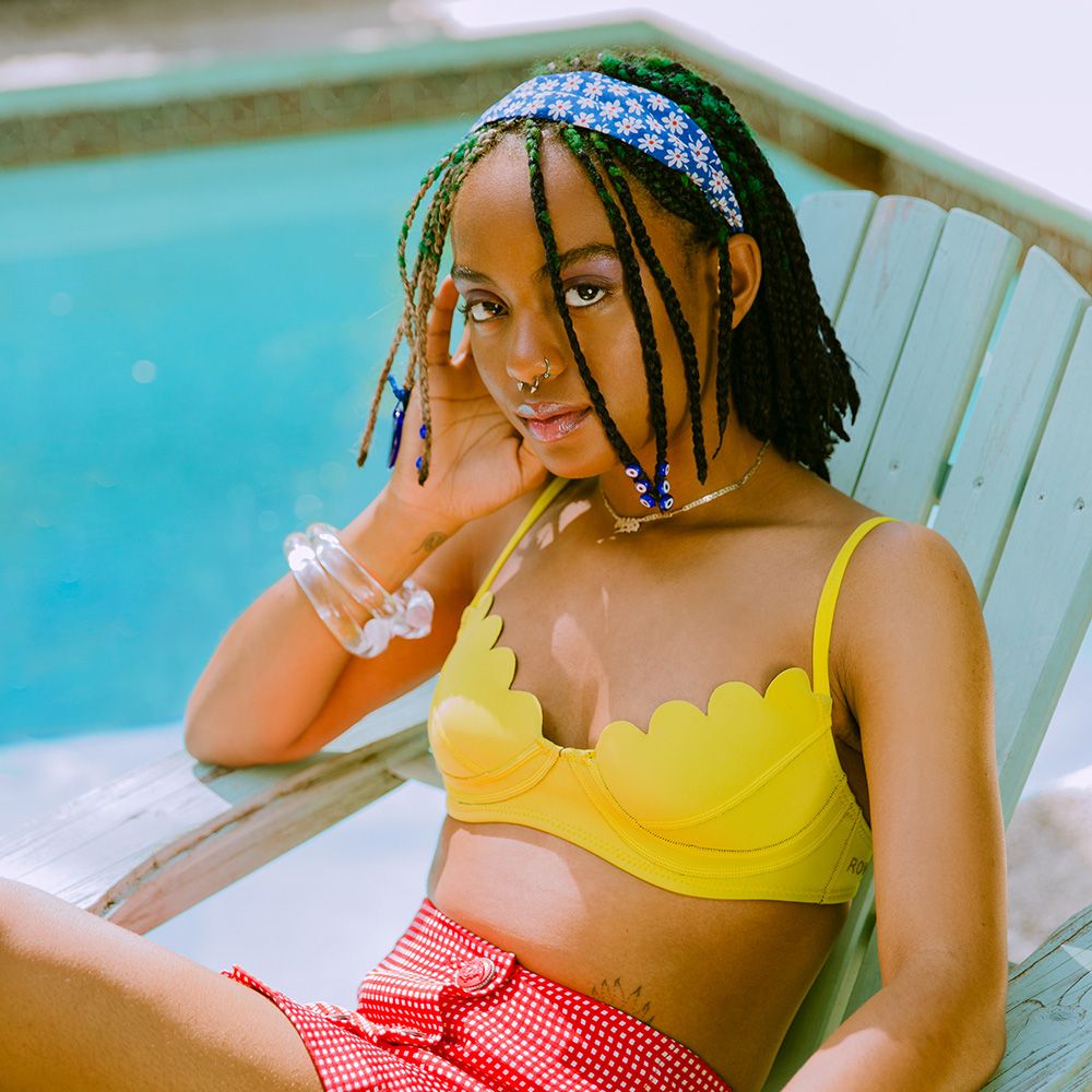 woman with braids by pool