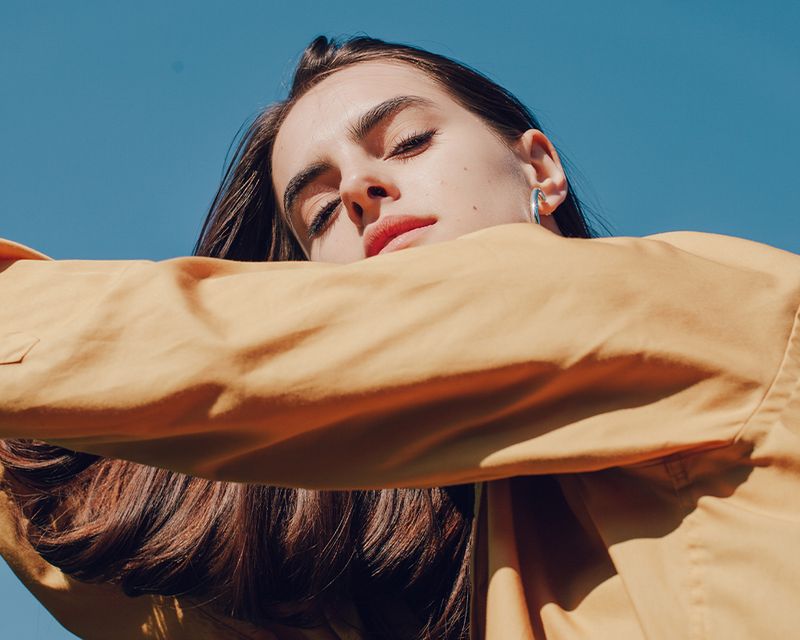 up view of a woman's face in the sunshine