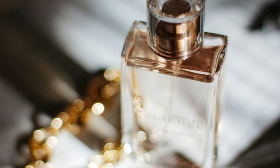 perfume bottle on shadowed backgrounds