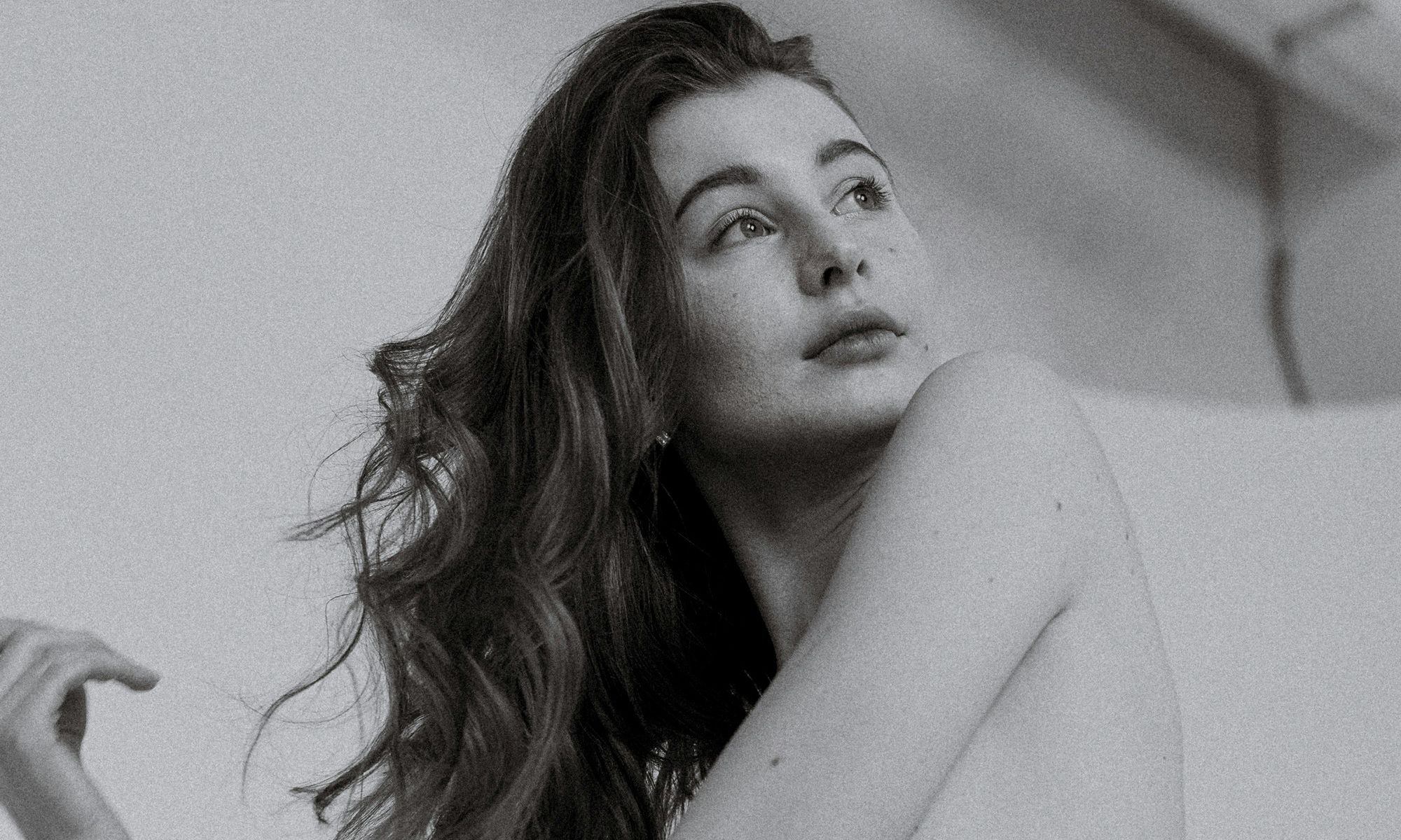 black and white photo of woman with curly hair