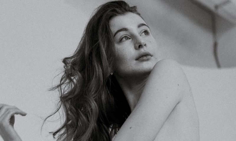 black and white photo of woman with curly hair