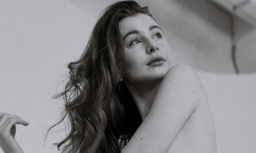 black and white photo of woman with curly hair