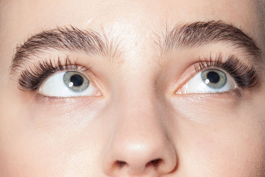 woman with lash extensions looking up
