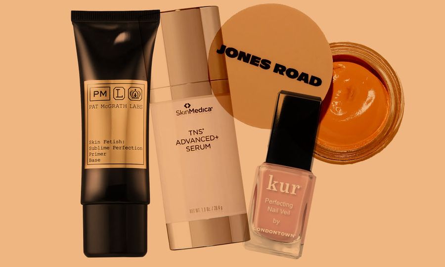 various beauty products on orange background