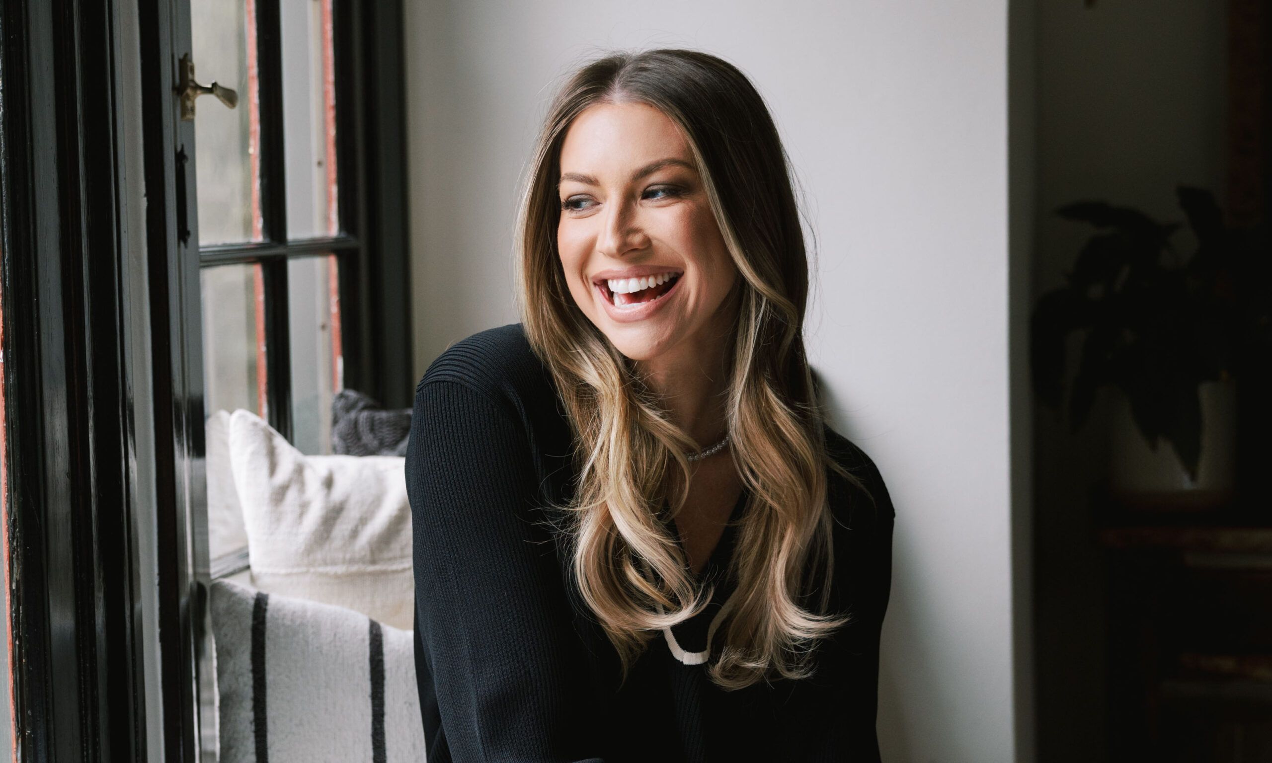 Stassi Schroeder Clark looking out window