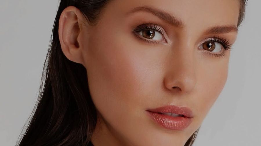 Model with doe-eyed makeup and soft glam look
