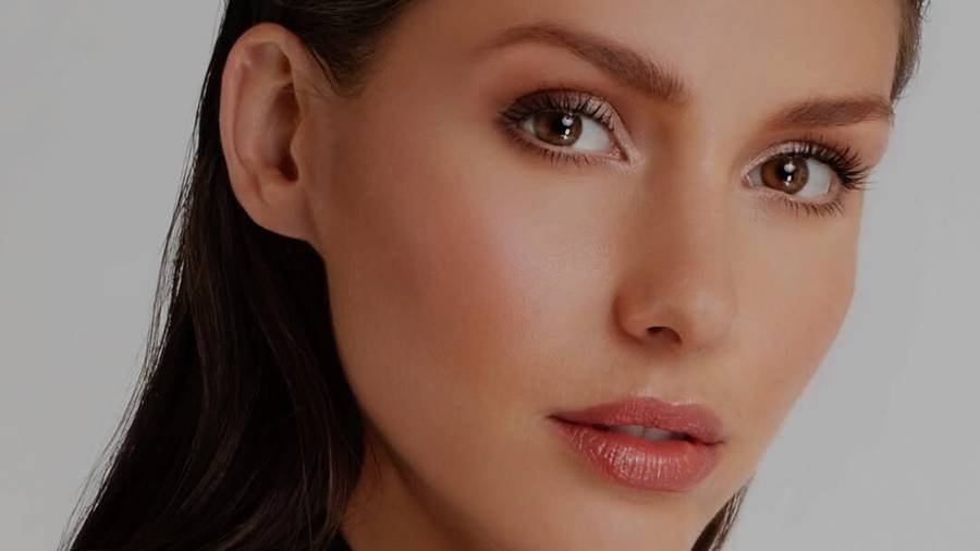 Model with doe-eyed makeup and soft glam look
