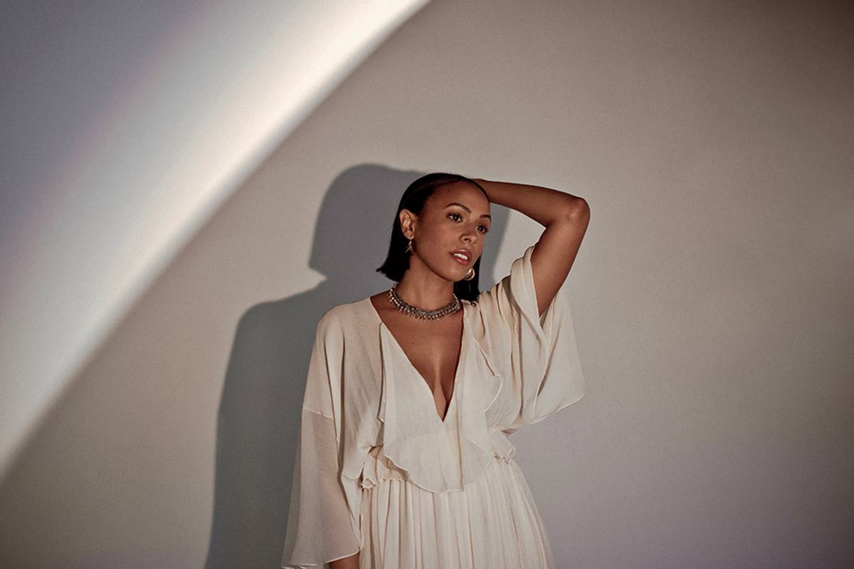 Nicolette Robinson in white dress