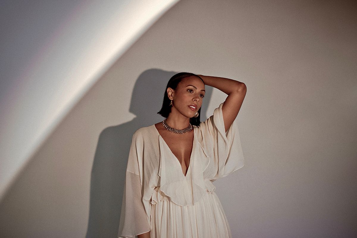 Nicolette Robinson in white dress