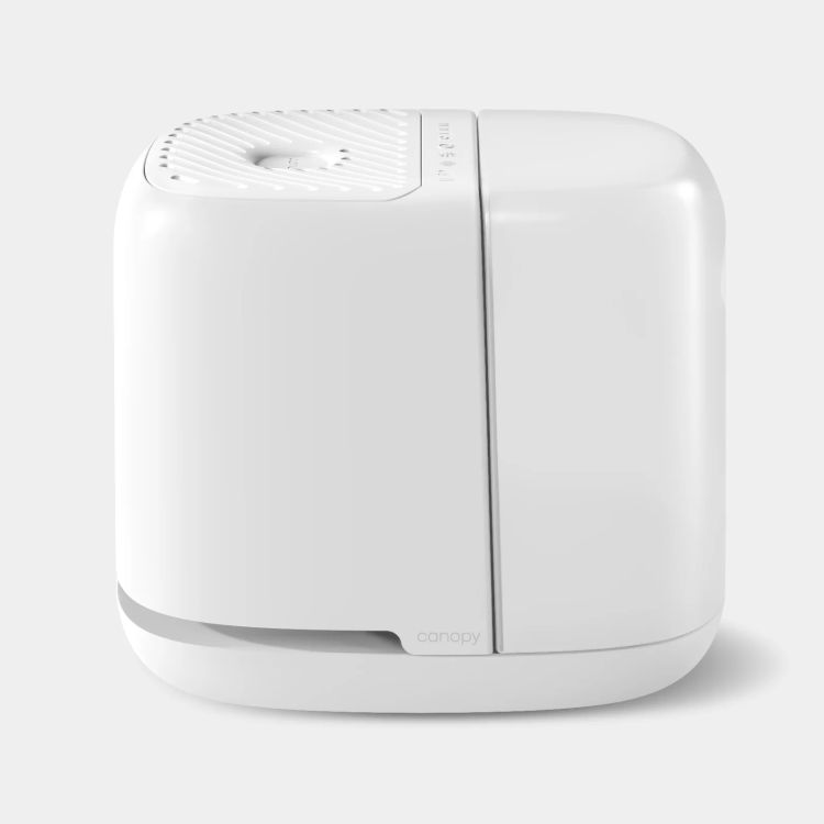 White Canopy baby humidifier with a compact, modern design and built-in filter, shown against a neutral background.