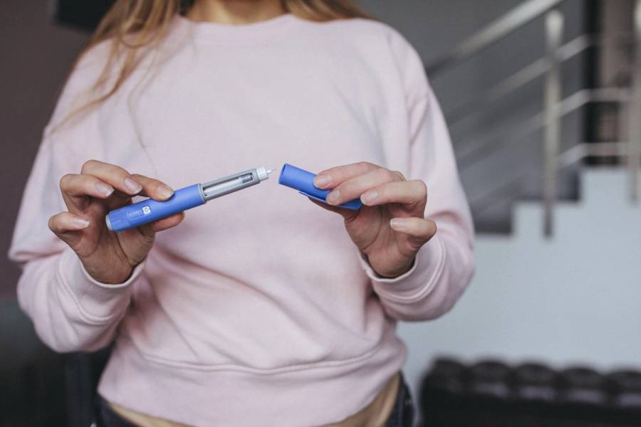 Semaglutide pen preparation for injection therapy captured in detail. The image depicts a medical device essential for individuals managing weight loss or type 2 diabetes.