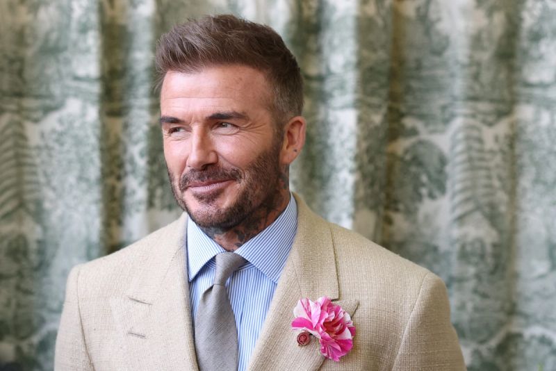 David Beckham wearing a David Austin Roses "King's Rose" waits to meet the King during a visit to the RHS Chelsea Flower Show at Royal Hospital Chelsea on May 20, 2025 in London, England.