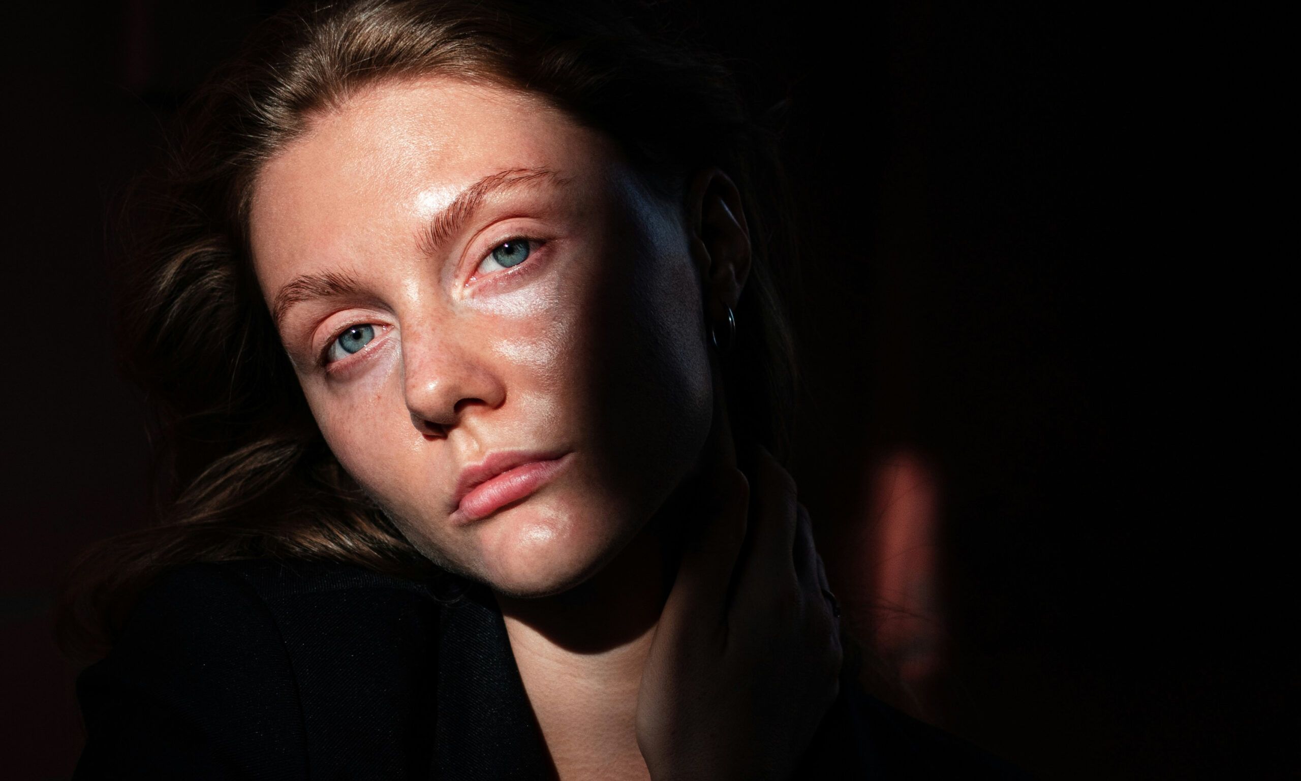 woman portrait shadows partially covering her face
