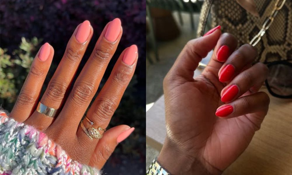 women's hands wearing shades of coral nail polish