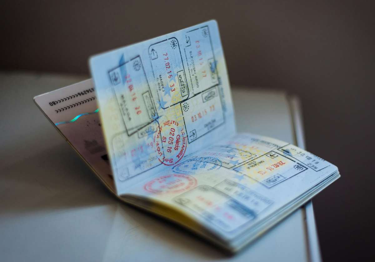 Open passport displaying international travel stamps, symbolizing the rise of global medical tourism and cosmetic procedures abroad.