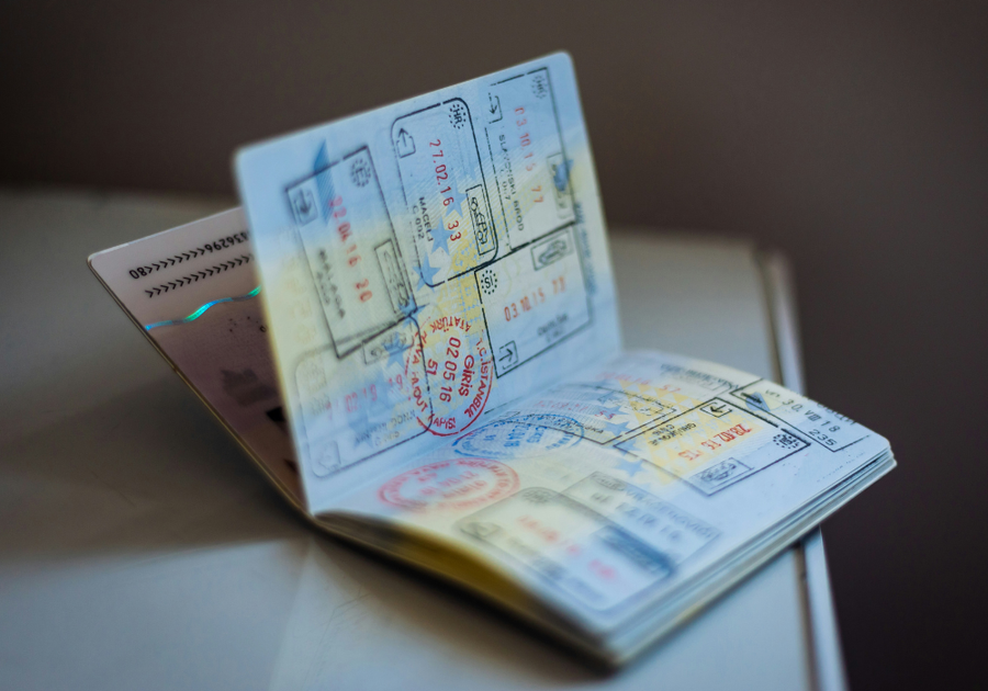 Open passport displaying international travel stamps, symbolizing the rise of global medical tourism and cosmetic procedures abroad.