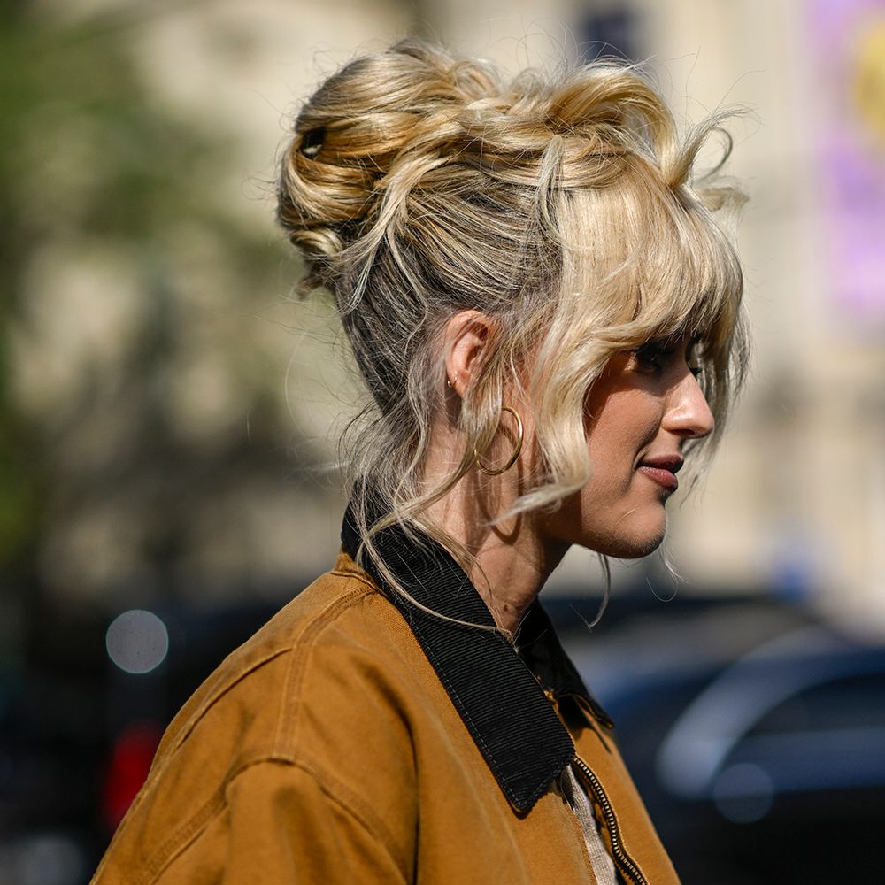 Photo of blonde woman wearing a messy updo