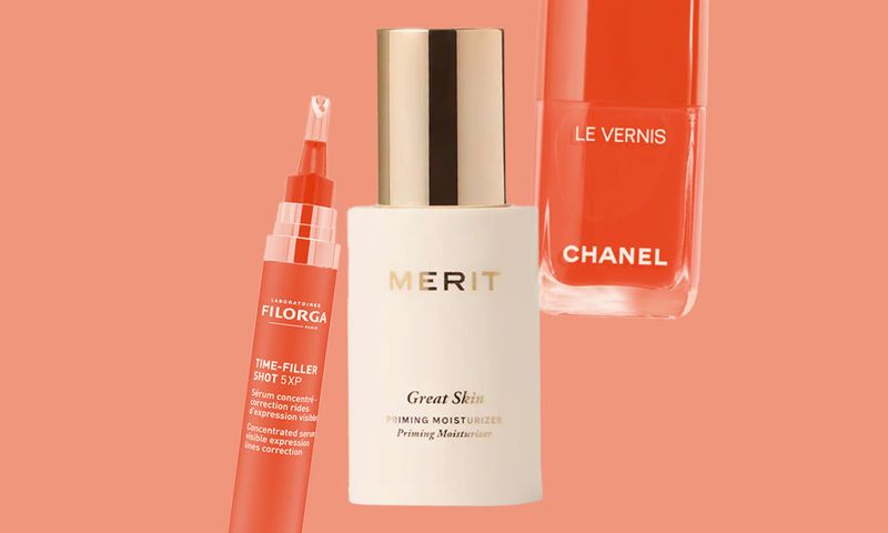 various beauty products on orange background