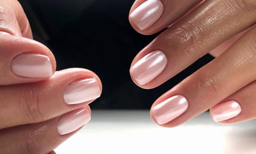 hands with glass nails manicure