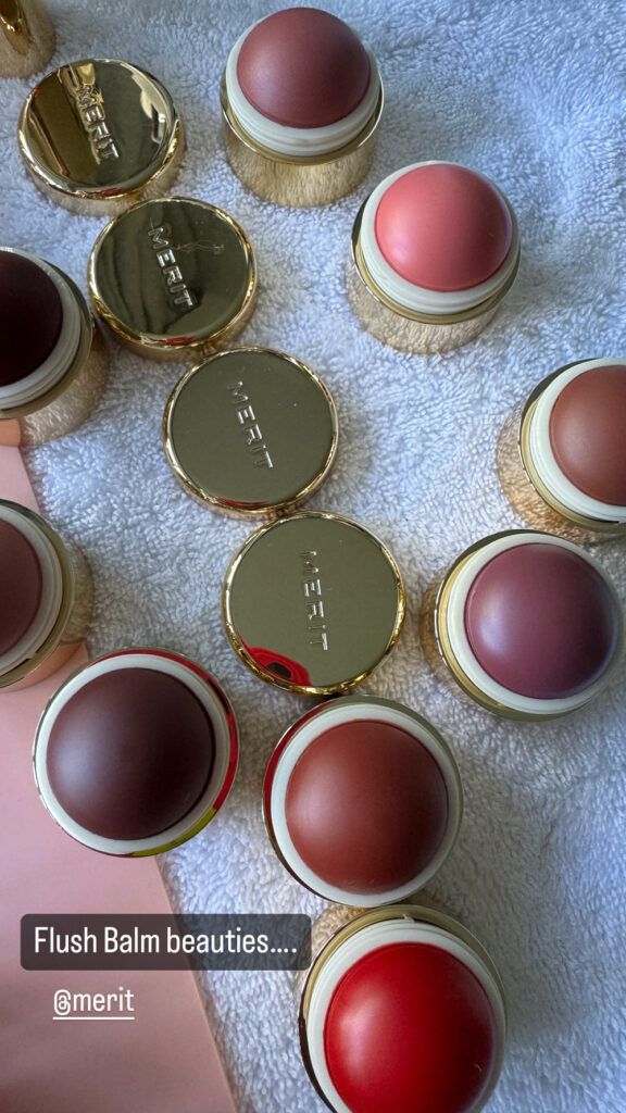 merit Beauty flush balms on towel surface
