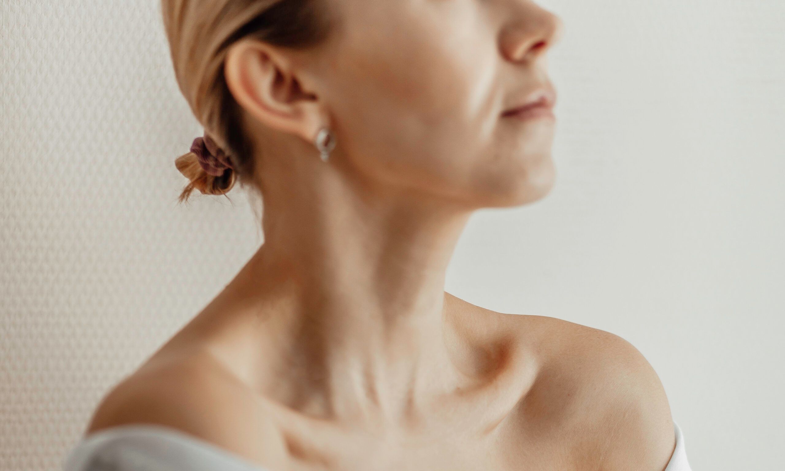 Woman baring neck and chest