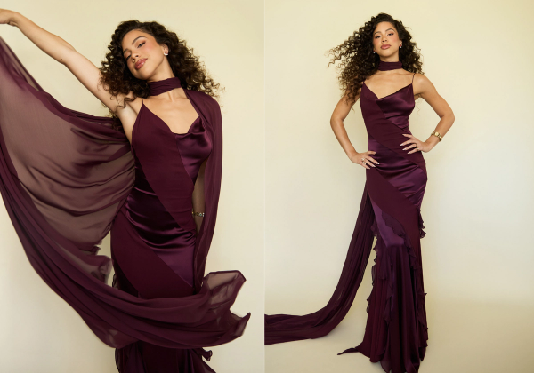 Kiara Romero poses in two side-by-side portraits wearing a deep plum satin gown with a flowing sheer scarf and voluminous curls.