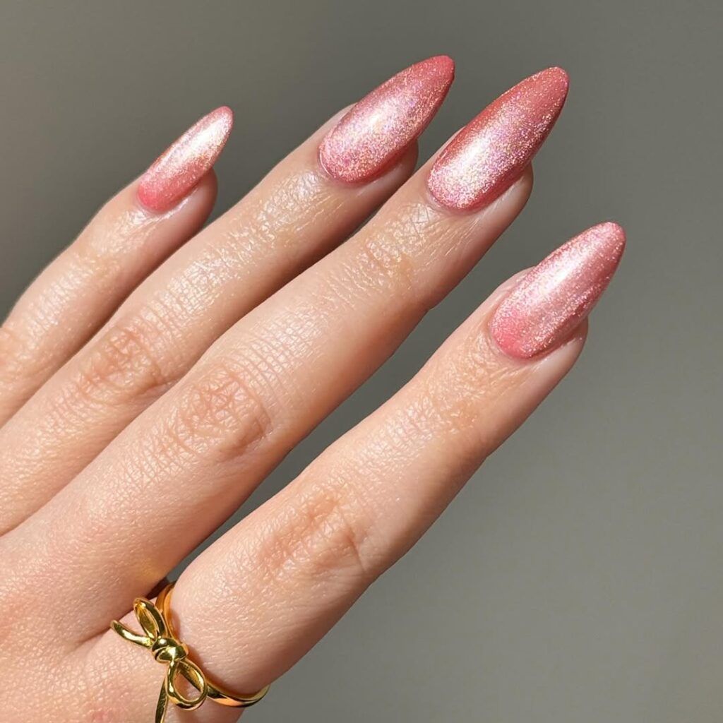 Long nails with shimmer pink cat eye design