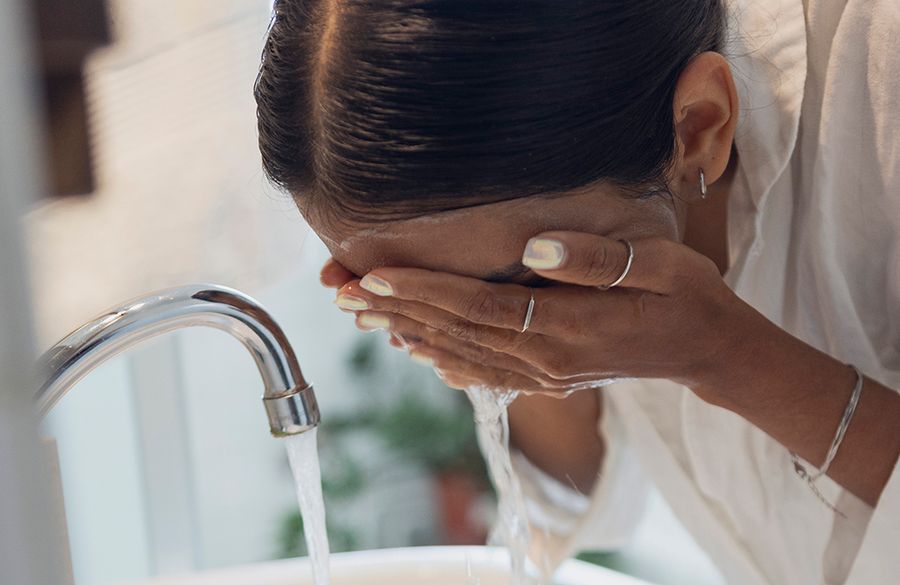 WOMAN WASHING HER FACE