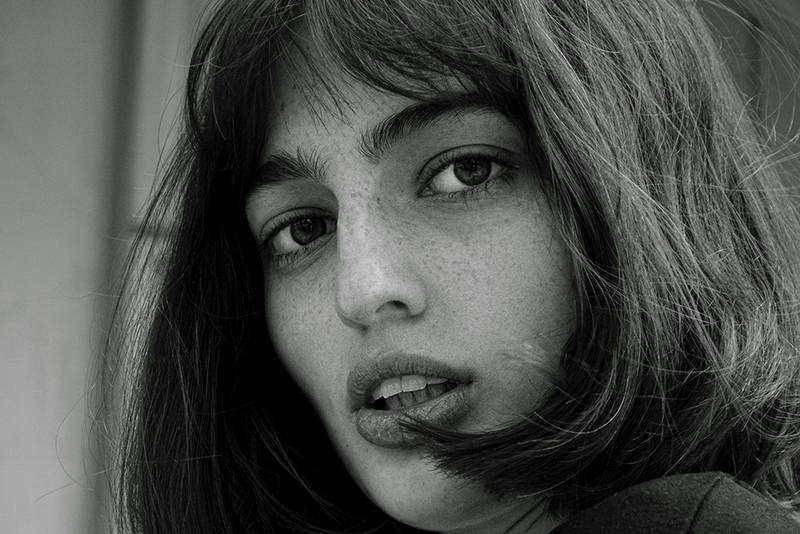 black and white photo of woman with bobs and bangs